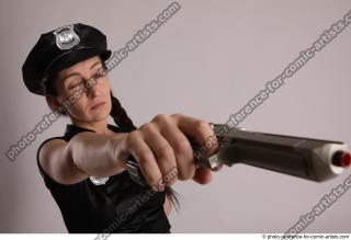 26 NIKITA POLICEWOMAN STANDING POSE WITH TWO GUNS